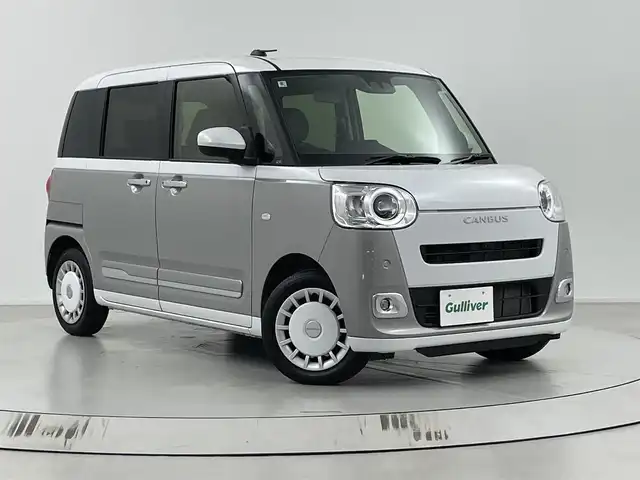 ダイハツ ムーヴ キャンバス ストライプス G 埼玉県 2024(令6)年 0.7万km シャイニングホワイトパール/スムーズグレーマイカメタリック 社外７インチナビ/全方位カメラ/クルーズコントロール/シートヒーター/衝突軽減システム/両側パワースライドドア/パーキングブレーキ/パーキングセンサー/ステアリングリモコン/社外フロアマット/スマートキー