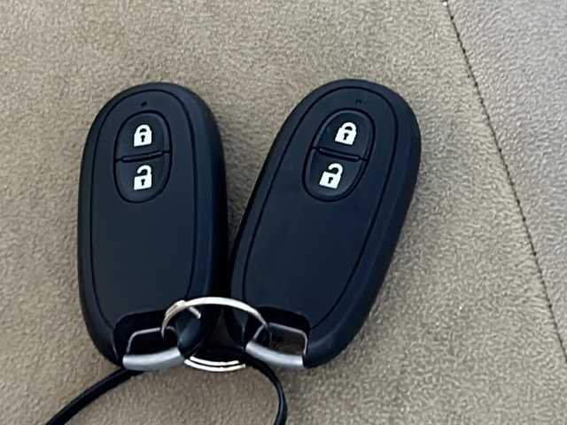 スズキ ラパン X 沖縄県 2016(平28)年 8.5万km シフォンアイボリーメタリック 禁煙車　/県外仕入れ　/８インチ社外ナビ/【ＣＤ／ＤＶＤ／フルセグＴＶ／ＢＴ】　/ＥＴＣ　/Ｄ席シートヒーター/横滑り防止装置　/衝突被害軽減システム/１４インチ純正アルミ　/オートライト　　/スマートキー