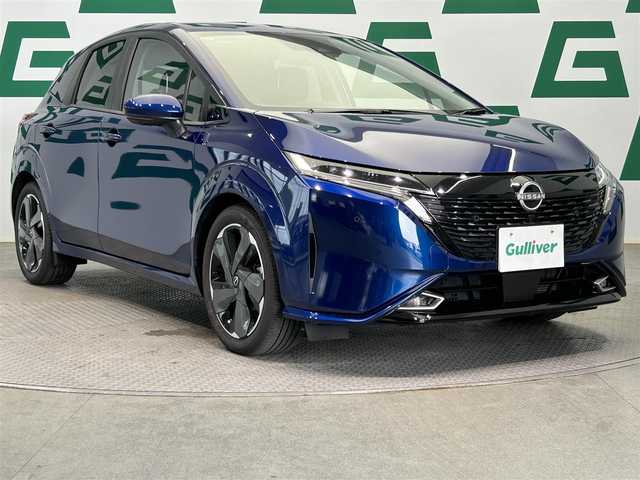 日産 オーラ G 鹿児島県 2024(令6)年 1.4万km オーロラフレアブルーパール 純正ナビ/(フルセグ/HDMI)/デジタルインナーミラー/ビルトインETC2.0/全方位カメラ/電動パーキングブレーキ/オートブレーキホールド/革巻きステアリング/ステアリングリモコン/LEDヘッドライト/フロントフォグランプ/BOSEパーソナルプラスサウンドシステム/インテリジェント エマージェンシーブレーキ/踏み間違い衝突防止アシスト/標識検知機能（進入禁止標識検知、最高速度標識検知、一時停止標識検知）/インテリジェント FCW（前方衝突予測警報）/LDW（車線逸脱警報）/インテリジェント DA（ふらつき警報）/インテリジェント LI （車線逸脱防止支援システム）/フロント&バックソナー/エマージェンシーストップシグナル/インテリジェント BSI（後側方衝突防止支援システム）/BSW（後側方車両検知警報）/RCTA（後退時車両検知警報）/車両接近通報装置