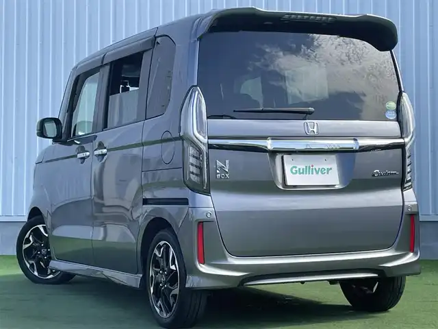 ホンダ Ｎ ＢＯＸ カスタム G EX ターボ ホンダセンシング 香川県 2017(平29)年 2.5万km シャイニンググレーM 登録時走行距離：24320km/ホンダセンシング/→衝突軽減ブレーキ/→渋滞時追走機能付きクルーズコントロール/→路外逸脱抑制機能/純正7インチナビ/→フルセグTV/→ＣＤ／ＤＶＤ/→Bluetooth/革巻きステアリング/ステアリングリモコン/純正15インチAW/スマートキー/プッシュスタート/純正フロアマット/電動格納ウィンカーミラー