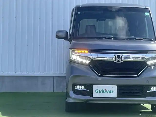 ホンダ Ｎ ＢＯＸ カスタム G EX ターボ ホンダセンシング 香川県 2017(平29)年 2.5万km シャイニンググレーM 登録時走行距離：24320km/ホンダセンシング/→衝突軽減ブレーキ/→渋滞時追走機能付きクルーズコントロール/→路外逸脱抑制機能/純正7インチナビ/→フルセグTV/→ＣＤ／ＤＶＤ/→Bluetooth/革巻きステアリング/ステアリングリモコン/純正15インチAW/スマートキー/プッシュスタート/純正フロアマット/電動格納ウィンカーミラー