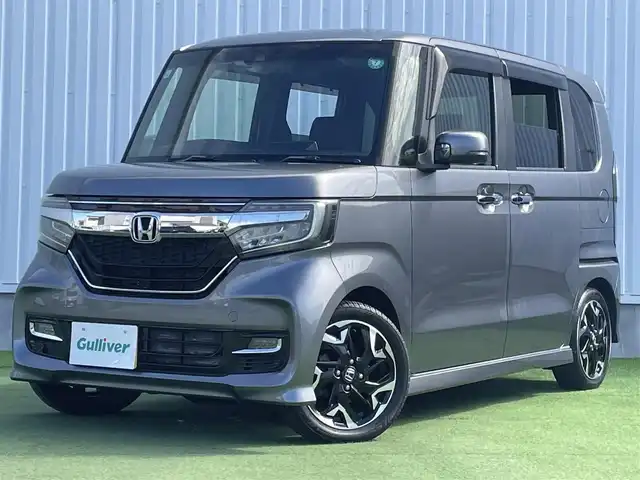 ホンダ Ｎ ＢＯＸ カスタム G EX ターボ ホンダセンシング 香川県 2017(平29)年 2.5万km シャイニンググレーM 登録時走行距離：24320km/ホンダセンシング/→衝突軽減ブレーキ/→渋滞時追走機能付きクルーズコントロール/→路外逸脱抑制機能/純正7インチナビ/→フルセグTV/→ＣＤ／ＤＶＤ/→Bluetooth/革巻きステアリング/ステアリングリモコン/純正15インチAW/スマートキー/プッシュスタート/純正フロアマット/電動格納ウィンカーミラー