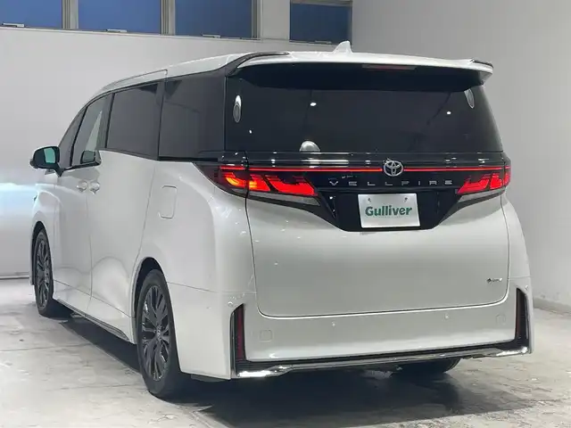 トヨタ ヴェルファイア ハイブリット Z プレミア 宮城県 2023(令5)年 5.5万km プラチナホワイトパールマイカ ツインムーンルーフ/トヨタセーフティーセンス/・プッシュスタートセーフティ/・レーンチェンジアシスト/・レーンディパーチャートアラート/・ロードサインアシスト/・リアクロストラフィックアラート/・フロントクロストラフィックアラート/・プロアクティブドライビングアシスト/・ブラインドスポットモニター/・パーキングサポートブレーキ/・後方車両接近告知/・周辺車両接近時サポート/・安全降車サポート/・クリアランスソナー/・リアカメラディテクション/純正ディスプレイオーディオ/・ナビ/Bluetooth/フルセグTV/USB/・全方位カメラ/・ETC2.0/・ドライブレコーダー/・純正デジタルインナーミラー/アイドリングストップ/純正ユニバーサルステップ/電子パーキング/・オートホールド/革巻きステアリング/・ステアリングヒーター（運転席/助手席/2列目席）/・ステアリングリモコン/レザーシート/・パワーシート（運転席/助手席/2列目席）/・エアシート（運転席/助手席/2列目席）/プッシュスタート/・スマートキー/LEDヘッドライト/・オートライト/・オートハイビーム/純正フロアマット
