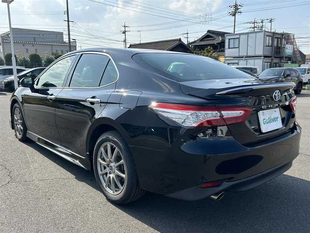 トヨタ カムリ G レザーパッケージ 岡山県 2018(平30)年 5.7万km アティチュードブラックマイカ 登録時走行距離56716km/モデリスタ/純正ナビ/フルセグTV(AM/FM/CD/DVD/Bluetooth)/バックカメラ/ビルトインETC2.0/ヘッドアップディスプレイ/トヨタセーフティセンス/・ブラインドスポットモニター/・レーダークルーズコントロール/・オートマチックハイビーム/・プリクラッシュセーフティ/・レーンディバーチャーアラート/横滑り防止装置/電子パーキング/オートブレーキホールド/D/N席パワーシート/D/N席シートヒーター/本革シート/純正フロアマット/17インチ社外AW
