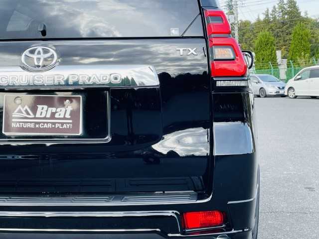 トヨタ ランドクルーザー プラド TX 愛知県 2019(平31)年 6.6万km ブラック AIS検査済み/ワンオーナ/モデリスタアンダーエアロ（前後）/寒冷地仕様/エンジンスターター/BRUT BR-55 新品アルミ/ダヴァンティ テラトゥーラ（ホワイトレター）265/65-18/サイドステップ/ボンネットエンブレム/LXグリル（社外）ー/純正オーディオ/USB:AUX:CD/ウッドコンビハンドル/バックフォグ/オートマチックハイビーム/保証書/取扱説明書/【2406047679】