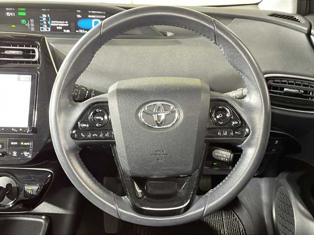 トヨタ プリウス A プレミアム 広島県 2019(平31)年 5万km シルバーM ALPINE９型ナビ/バックカメラ/温/冷シート/パワーシート(運転席)/パーキングアシスト/ブラインドスポットモニター/ヘッドアップディスプレイ/レーダークルーズコントロール/ＨＤＭＩ/1500W給電/前方ドラレコ/ＥＴＣ/オートマチックハイビーム/レーンキープ/衝突軽減/踏み間違い防止/コーナーセンサー/フルセグ/純正15インチホイールカバー(195/65/R15)/エアバッグ(運転席/助手席/サイド/カーテン)