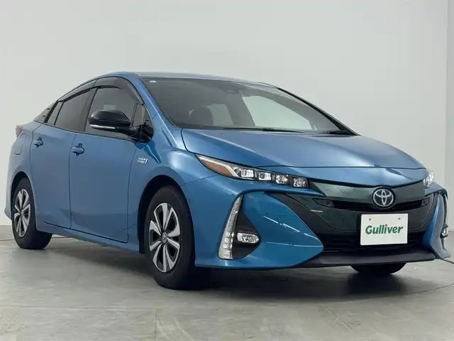 トヨタ プリウス ＰＨＶ A プレミアム 愛知県 2017(平29)年 5.3万km スピリテッドアクアメタリック 純正11.2インチナビ/・フルセグTV/Bluetooth/HUD/純正ドライブレコーダー/ビルトインETC/パーキングアシスト/プッシュスタート/ステアリングリモコン/ステアリングヒーター/パワーシート/ブラックレザー調シート/シートヒーター/バックカメラ/トヨタセーフティセンス/　　・プリクラッシュセーフティ/　　・レーンディバーチャーアラート/　　・レーダークルーズコントロール/　　・オートハイビーム/インテリジェントクリアランスソナー/LEDヘッドライト/フォグランプ/取扱説明書/スマートキー