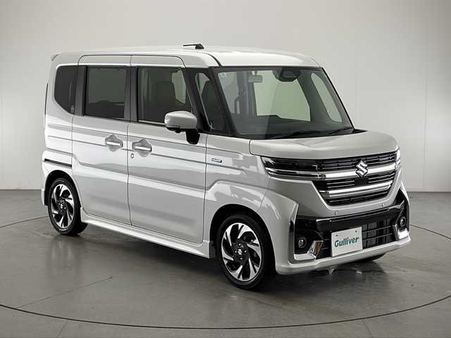 スズキ スペーシア カスタム HYBRID XS 宮崎県 2024(令6)年 0.4万km ピュアホワイトP 禁煙車/衝突被害軽減ブレーキ/純正9型ディスプレイオーディオナビTV/（Bluetooth/USB/HDMI/FMAM/フルセグTV)/純正LEDオートライト/純正LEDフォグ/純正15インチアルミ/純正エアロ/純正ルーフエンドスポイラー/両側電動スライドドア/アダプティブクルーズコントロール/レーンディパーチャーアラート/クリアランスソナー/ヘッドアップディスプレイ/エネチャージ/オートエアコン/前席シートヒーター/ステアリングヒーター/ハーフレザーシート/本革巻ハンドル/スマートキー/プッシュエンジンスタート/新車時保証書/取扱い説明書