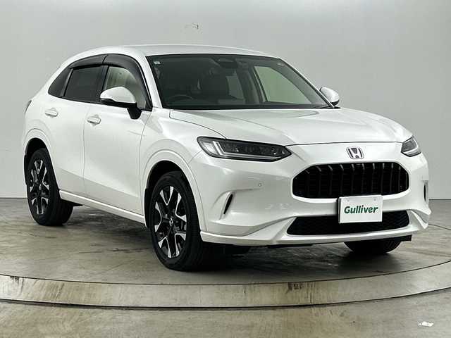 ホンダ ＺＲ－Ｖ ハイブリッド e:HEV Z 愛知県 2023(令5)年 2.9万km プラチナホワイトパール 禁煙車/純正9インチナビ/（AM/FM/Bluetooth/USB/フルセグTV）/全方位カメラ/BOSEサウンド/シーケンシャルウインカー/ワイヤレス充電/ホンダセンシング/・衝突軽減ブレーキ/・レーンキープアシスト/・アダプティブクルーズコントロール/・トラフィックジャムアシスト/・誤発進抑制機能/・パーキングセンサー/・オートハイビーム/・ブラインドスポットインフォメーション/ETC2.0/前後ドライブレコーダー/レザシート/パワーシート/メモリシート/シートヒーター/革巻きステアリング/ステアリングヒーター/パワーバックドア/ダウンヒルアシスト/純正18インチアルミホイール/スマートキー/プッシュスタート/LEDヘッドライト/オートライト/純正フロアマット/横滑り防止装置/電動格納ミラー/電子パーキングぶらーき/オートホールド