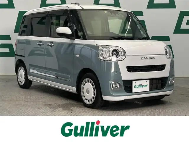 ダイハツ ムーヴ キャンバス ストライプス G ターボ 鹿児島県 2022(令4)年 2.9万km シャイニングホワイトパール/レイクブルーメタリック ワンオーナー　/禁煙車　/純正ディスプレイオーディオ　/全方位カメラ　/スマートアシスト　/・衝突警報/・衝突回避ブレーキ/・誤発進抑制機能（前後）/・車線逸脱警報/・先行車発進お知らせ機能/両側パワースライドドア　/前後コーナーセンサー　/前席シートヒーター　/ホッとカップホルダー/置くだけ充電/純正フロアマット　/ＬＥＤヘッドライト　/ＥＴＣ　/前後ドライブレコーダー/オートライト/オートマチックハイビーム/ドアバイザー
