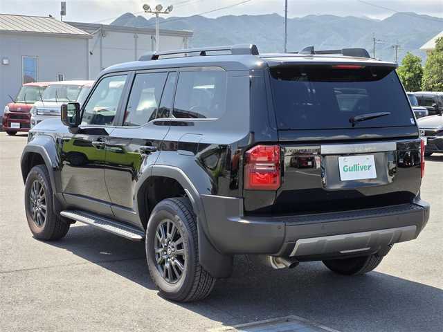 トヨタ ランドクルーザー ２５０ VX 鹿児島県 2025(令7)年 0.2万km ブラック ムーンルーフ　/ビルトインＥＴＣ２．０　/レーダークルーズコントロール　/パノラミックビューモニター　/トヨタチームメイト　/パワーバックドア　/デジタルインナーミラー　/Ｄ＋Ｎ席シートヒーター／エアシート/純正ディスプレイオーディオ/Bluetoothオーディオ/ステアリングヒーター/前後純正ドライブレコーダー/前後コーナーセンサー/レーンキープアシスト/横滑り防止装置/LEDヘッドライト/プッシュスタート/スマートキー/エアバッグ(W+サイド)