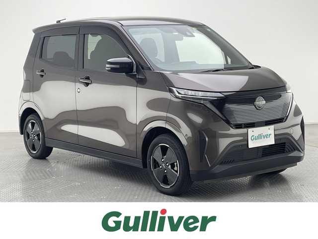 日産 サクラ X 兵庫県 2023(令5)年 3万km 茶 純正9インチディスプレイオーディオ/（BT、APPLECarPlay、Android　Aut）/バックカメラ/先行車発進お知らせ/ウィンカーミラー/オートライト/純正フロアマット/ドアバイザー/LEDヘッドライト/プッシュスタート/Eペダル/スマートキー/純正14インチAW