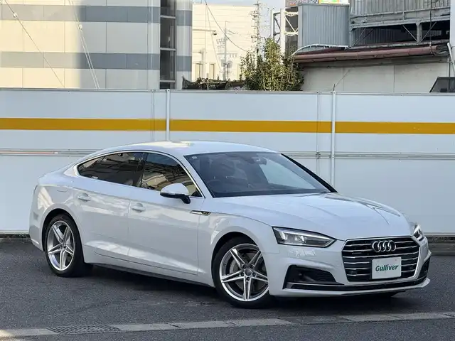 アウディ Ａ５ SB2．0TFSI Q スポーツ 愛知県 2017(平29)年 2万km グレイシアホワイトメタリック /正規ディーラー車//禁煙車//7速Sトロニック//Sラインパッケージ//マトリクスLED//バーチャルコックピット//MMIナビ//フルセグ/BT/CD/DVD/MSV/SD/USB/AUX//バックカメラ//ETC2.0//前後ドライブレコーダー//ハーフレザーシート//パワーシート//ランバーサポート//シートヒーター//電動リアゲート//アウディプレセンス//アクティブレーンアシスト//渋滞アシスト//レーダークルーズコントロール//パーキングエイド//エフィシエンシアシスト//アウディドライブセレクト//Efficiency/Comfort/Dynamic/Individual//ESC//パドルシフト//MTモード付きAT//純正18インチアルミホイール//スピードリミッター//アイドリングストップ//シーケンシャルウィンカー//ハイビームアシスト//リアフォグランプ//デイライムランニングライト//オールウェザーライト//カミング・リービングホームライト//プッシュスタート//スペアスマートキー//革巻きステアリング//ステアリングリモコン//チルト＆テレスコピックステアリング//純正フロアマット//トノカバー//レインセンサー//オートリトラクタブルウィンカーミラー//保証書/取扱説明書//D記録簿H30.R1.5.6