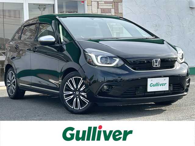 ホンダ フィット リュクス 徳島県 2020(令2)年 1.5万km クリスタルブラックパール 社外SDナビ　VXM-205VFET/　AM/FM/BT/iPod/SD/USB/DISC/バックカメラ/追従式クルーズコントロール/ビルトインETC/ドアバイザー/クリアランスソナー/オートブレーキホールド/ECON/アイドリングストップ/シートヒーター/エアーシート/ハーフレザーシート/ワンオーナー/LEDヘッドライト/コーナーセンサー