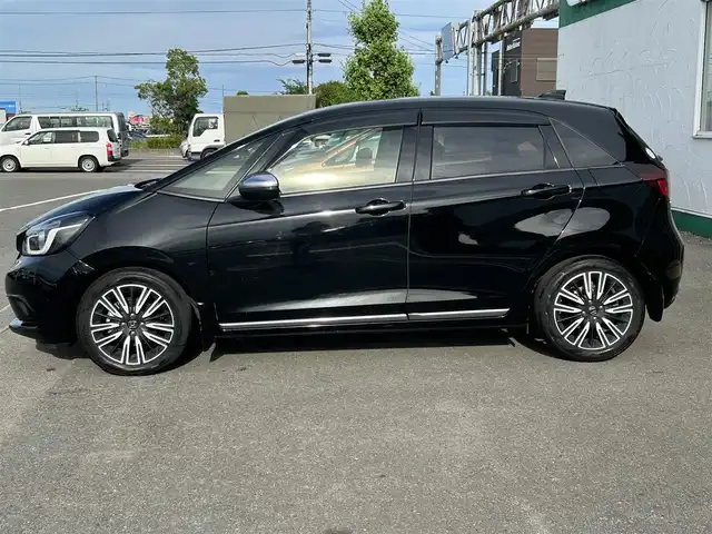 ホンダ フィット リュクス 徳島県 2020(令2)年 1.5万km クリスタルブラックパール 社外SDナビ　VXM-205VFET/　AM/FM/BT/iPod/SD/USB/DISC/バックカメラ/追従式クルーズコントロール/ビルトインETC/ドアバイザー/クリアランスソナー/オートブレーキホールド/ECON/アイドリングストップ/シートヒーター/エアーシート/ハーフレザーシート/ワンオーナー/LEDヘッドライト/コーナーセンサー