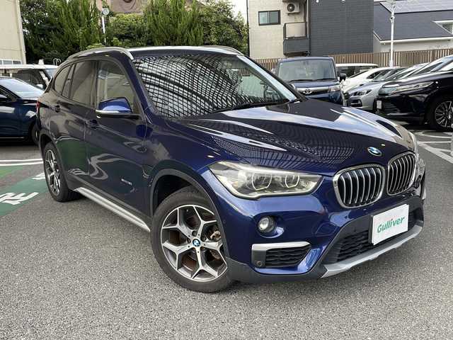ＢＭＷ Ｘ１ 福岡県 2017(平29)年 11.2万km メディテラニアンブルー 純正ナビ/（AM/FM/CD/DVD/USB/Bluetooth）/アイドリングストップ/横滑り防止/パーキングアシスト/衝突軽減ブレーキ/歩行者衝突軽減ブレーキ/車線逸脱警告/ハンズフリー/パワーシート（運転席/助手席）/シートヒーター（運転席/助手席）/シートメモリー（運転席）/パワーバックドア/ビルドインETC/SPORTモード/ECOモード/オートワイパー/オートライト/フォグランプ/電格ミラー/純正アルミホイール/スペアキー×１/プッシュスタート/保証書/取扱説明書