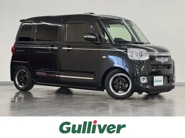 ダイハツ ムーヴ キャンバス セオリー G ターボ 三重県 2023(令5)年 2.4万km ブラックマイカメタリック ガソリン・ターボ/FF/インパネCVT/【ローダウン】RSR ダウンサスキット/純正 7インチナビ NMZK-W73D/（FM/AM/CD/DVD/TV/iPod/USB/SD/Bluetooth）/バックカメラ/両側パワースライドドア/衝突回避支援機能 スマートアシスト/・衝突回避支援ブレーキ機能（対車両・対歩行者（昼夜））/・衝突警報機能（対車両・対歩行者（昼夜））/・誤発進抑制機能（前方・後方）/・車線逸脱抑制制御機能/・車線逸脱警報機能、路側逸脱警報機能/・ふらつき警報/・レーダークルーズコントロール/・コーナーセンサー（フロント2個／リヤ4個）/・標識認識機能（進入禁止／最高速度／一時停止）/・サイドビューランプ（常時点灯式）/装備/・ホッとカップホルダー（ワンタッチオープン機能／タッチ＆ゴーロック機能付）/・シートヒーター（D/N）/・オートエアコン/・オートライト/・LED ヘッドランプ＆フロントフォグランプ/・電子パーキングブレーキ（ブレーキホールド機能付）/・ステアリングスイッチ/・社外14inAW/・保/取/ナビ取/・スマートキーx2/など