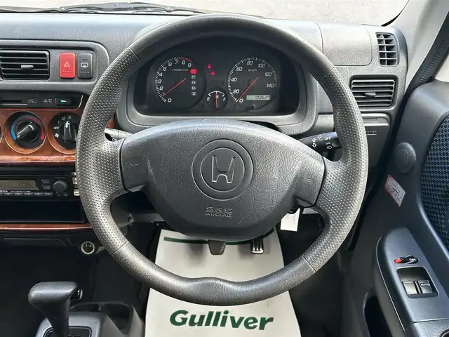 ホンダ バモス ホビオ M 和歌山県 2005(平17)年 10.4万km プレミアムホワイトパール 社外レザー調シートカバー/社外LEDヘッドライト/純正CD/キーレス