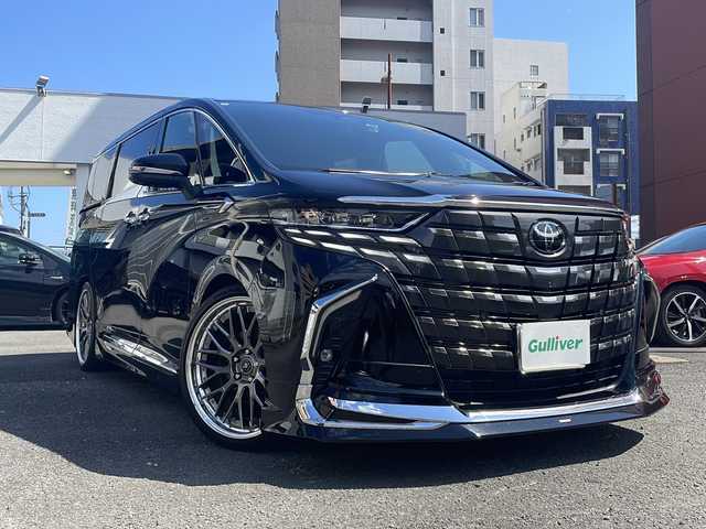トヨタ アルファードハイブリット Z 宮崎県 2024(令6)年 3.2万km ブラック 純正14インチディスプレイオーディオナビ/フリップダウンモニター/三眼LEDヘッドライト/全方位カメラ/両側パワースライドドア/ガラスルーフ/レーダークルーズコントロール/シートヒーター/エアシート/フルセグTV/Bluetooth/バックカメラ/電動リアゲート/パワーシート/ヘッドアップディスプレイ/コーナーセンサー/社外アルミホイール（VERZ)/ETC2.0/ブラインドスポットモニター/パドルシフト/ステアリングヒーター/オートマチックハイビーム/置くだけ充電器/ドライブレコーダー前後/ステアリングスイッチ/衝突被害軽減ブレーキ/スマートキー/プッシュスタート