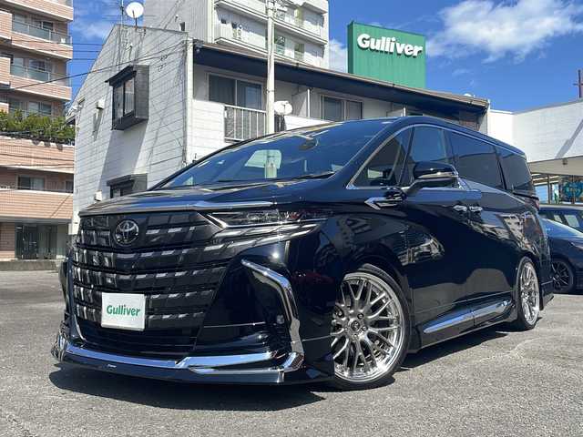 トヨタ アルファードハイブリット Z 宮崎県 2024(令6)年 3.2万km ブラック 純正14インチディスプレイオーディオナビ/フリップダウンモニター/三眼LEDヘッドライト/全方位カメラ/両側パワースライドドア/ガラスルーフ/レーダークルーズコントロール/シートヒーター/エアシート/フルセグTV/Bluetooth/バックカメラ/電動リアゲート/パワーシート/ヘッドアップディスプレイ/コーナーセンサー/社外アルミホイール（VERZ)/ETC2.0/ブラインドスポットモニター/パドルシフト/ステアリングヒーター/オートマチックハイビーム/置くだけ充電器/ドライブレコーダー前後/ステアリングスイッチ/衝突被害軽減ブレーキ/スマートキー/プッシュスタート