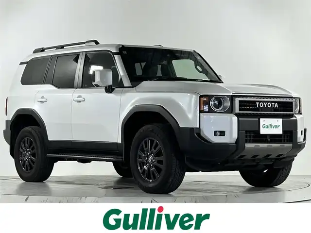 トヨタ ランドクルーザー ２５０ VX 佐賀県 2024(令6)年 1万km パール ワンオーナー/純正12.3インチディオスプレイオーディオ/ナビ機能付き/フルセグTV/Bluetooth/Androidauto/Applecarplay/サンルーフ/メーカーオプション丸目LEDヘッドライト/全方位カメラ/デジタルインナールームミラー/衝突被害軽減システム/レーダークルーズコントロール/レーンアシスト/ブラインドスポットモニター/クリアランスソナー/ビルトインETC2.0/純正前後ドライブレコーダー/電子パーキング/ブレーキホールド/オートライト/オートマチックハイビーム/LEDフォグライト/ステアリングヒーター/運転席パワーシート/運転席・助手席シートヒーター/運転席・助手席エアシート/合皮シート/パワーバックドア/ルーフレール/４WD/純正フロアマット/純正18インチアルミホイール/スペアキー×１