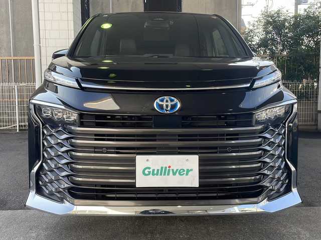 トヨタ ヴォクシー ハイブリッド S－Z 京都府 2023(令5)年 5万km アティチュードブラックマイカ 純正10インチナビ/純正14インチフリップダウンモニター/バックカメラ/レーダークルーズコントロール/レーンキープアシスト/衝突軽減システム/コーナーセンサー前後/ドライブレコーダー前後/ブレーキホールド/PCS・PDA・RSA・PKSB/前席シートヒーター/両側パワースライドドア/3眼LEDヘッドライト/nanoex/クリアランスソナー/ユニバーサルステップ/ETC2.0/純正17インチAW/保証書・取扱説明書