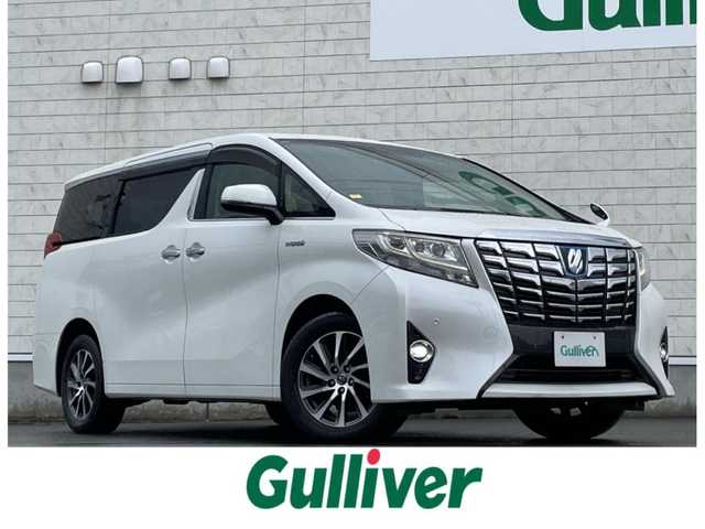トヨタ アルファードハイブリット G 山形県 2016(平28)年 7.6万km ホワイトパールクリスタルシャイン 禁煙車/4WD/純正10インチナビ//フルセグ/CD/DVD/SD/AM//FM/iPod/BT/AUX/純正フリップダウンモニター/ハーフレザーシート/ETC/クルーズコントロール/プリクラッシュセーフティー/ステアリングスイッチ/オートLEDヘッドライト/オートワイパー/フォグランプ/プッシュスタート