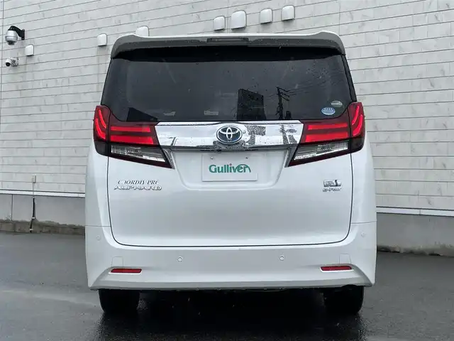 トヨタ アルファードハイブリット G 山形県 2016(平28)年 7.6万km ホワイトパールクリスタルシャイン 禁煙車/4WD/純正10インチナビ//フルセグ/CD/DVD/SD/AM//FM/iPod/BT/AUX/純正フリップダウンモニター/ハーフレザーシート/ETC/クルーズコントロール/プリクラッシュセーフティー/ステアリングスイッチ/オートLEDヘッドライト/オートワイパー/フォグランプ/プッシュスタート