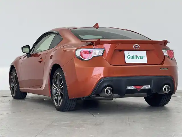 トヨタ ８６ GT リミテッド 愛知県 2015(平27)年 1.2万km オレンジメタリック GTリミテッド/革巻きステアリング/ハーフレザーシート/純正ナビ/（CD/ラジオ/BT/ワンセグ）/純正リアスポイラー/AT/DNシートヒーター/クルコン/バックカメラ/ETC/横滑り防止/VSC　SPORT/SNOWモード/ドアバイザー/デュアルエアコン/スペアキー