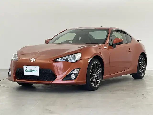 トヨタ ８６ GT リミテッド 群馬県 2015(平27)年 1.2万km オレンジメタリック 純正SDナビ 　＜NSCP-W64＞/（CD/ラジオ/Bluetooth/ワンセグTV）/バックカメラ/ETC/純正リアスポイラー/クルーズコントロール/D/N席シートヒーター/ハーフレザーシート/走行制御モードスイッチ（スポーツ/スノー）/VSC（ビークルスタビリティコントロール）/パドルシフト/革巻きステアリング/デュアルエアコン/ドアバイザー