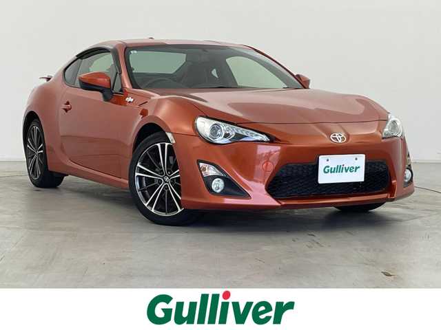 トヨタ ８６ GT リミテッド 群馬県 2015(平27)年 1.2万km オレンジメタリック 純正SDナビ 　＜NSCP-W64＞/（CD/ラジオ/Bluetooth/ワンセグTV）/バックカメラ/ETC/純正リアスポイラー/クルーズコントロール/D/N席シートヒーター/ハーフレザーシート/走行制御モードスイッチ（スポーツ/スノー）/VSC（ビークルスタビリティコントロール）/パドルシフト/革巻きステアリング/デュアルエアコン/ドアバイザー