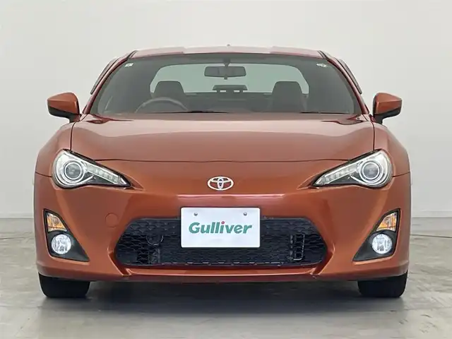 トヨタ ８６ GT リミテッド 群馬県 2015(平27)年 1.2万km オレンジメタリック 純正SDナビ 　＜NSCP-W64＞/（CD/ラジオ/Bluetooth/ワンセグTV）/バックカメラ/ETC/純正リアスポイラー/クルーズコントロール/D/N席シートヒーター/ハーフレザーシート/走行制御モードスイッチ（スポーツ/スノー）/VSC（ビークルスタビリティコントロール）/パドルシフト/革巻きステアリング/デュアルエアコン/ドアバイザー