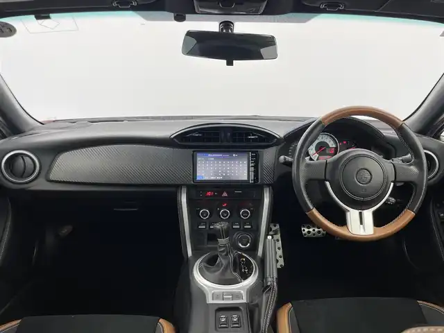 トヨタ ８６ GT リミテッド 群馬県 2015(平27)年 1.2万km オレンジメタリック 純正SDナビ 　＜NSCP-W64＞/（CD/ラジオ/Bluetooth/ワンセグTV）/バックカメラ/ETC/純正リアスポイラー/クルーズコントロール/D/N席シートヒーター/ハーフレザーシート/走行制御モードスイッチ（スポーツ/スノー）/VSC（ビークルスタビリティコントロール）/パドルシフト/革巻きステアリング/デュアルエアコン/ドアバイザー