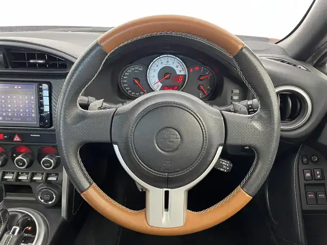 トヨタ ８６ GT リミテッド 群馬県 2015(平27)年 1.2万km オレンジメタリック 純正SDナビ 　＜NSCP-W64＞/（CD/ラジオ/Bluetooth/ワンセグTV）/バックカメラ/ETC/純正リアスポイラー/クルーズコントロール/D/N席シートヒーター/ハーフレザーシート/走行制御モードスイッチ（スポーツ/スノー）/VSC（ビークルスタビリティコントロール）/パドルシフト/革巻きステアリング/デュアルエアコン/ドアバイザー