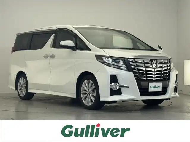 トヨタ アルファード S Aパッケージ 滋賀県 2015(平27)年 3.8万km ホワイトパールクリスタルシャイン 禁煙車/純正ナビ/（CD/DVD/BT/SD/フルセグ）/後席フリップダウンモニター/両側電動スライドドア/サンルーフ/バックカメラ/ビルトインETC/クルーズコントロール/横滑り防止装置/オートエアコン/オットマン/電動パーキング/オートホールド/LED/前後ソナー/プッシュスタート