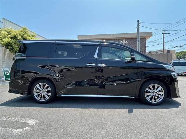 トヨタ ヴェルファイア ゴールデンアイズⅡ 静岡県 2021(令3)年 3.9万km ブラック エンジンスタートボタン/取扱説明書/パワーステアリング/パワーウィンドウ/100V充電/スマートキー/スペアキー１本/Wオートエアコン/クルーズコントロール/フリップダウンモニター/USB入力端子/純正ETC2.0/バックカメラ/純正９インチナビ（CD/DVD/BT）/三列シート/サンルーフ/オットマン/電動リアゲート/ドライブレコーダー前後/ウォークスルー/フロアマット/ハーフレザー/両側パワースライドドア/純正18インチアルミホイール/ABS/横滑り防止装置/コーナーセンサー前後/レーンキープアシスト/オートライト/オートマチックハイビーム/三眼LEDヘッドライト/W+サイドエアバック/衝突軽減システム/カーテンエアバック/BSM(ブラインドスポットモニター)