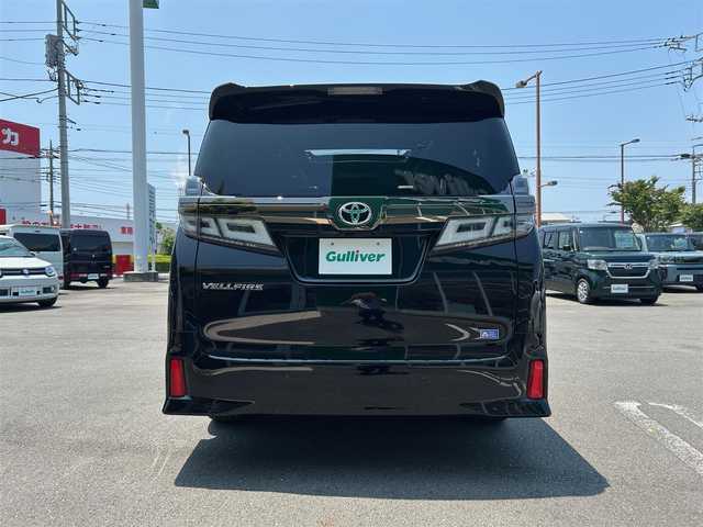 トヨタ ヴェルファイア ゴールデンアイズⅡ 静岡県 2021(令3)年 3.9万km ブラック エンジンスタートボタン/取扱説明書/パワーステアリング/パワーウィンドウ/100V充電/スマートキー/スペアキー１本/Wオートエアコン/クルーズコントロール/フリップダウンモニター/USB入力端子/純正ETC2.0/バックカメラ/純正９インチナビ（CD/DVD/BT）/三列シート/サンルーフ/オットマン/電動リアゲート/ドライブレコーダー前後/ウォークスルー/フロアマット/ハーフレザー/両側パワースライドドア/純正18インチアルミホイール/ABS/横滑り防止装置/コーナーセンサー前後/レーンキープアシスト/オートライト/オートマチックハイビーム/三眼LEDヘッドライト/W+サイドエアバック/衝突軽減システム/カーテンエアバック/BSM(ブラインドスポットモニター)