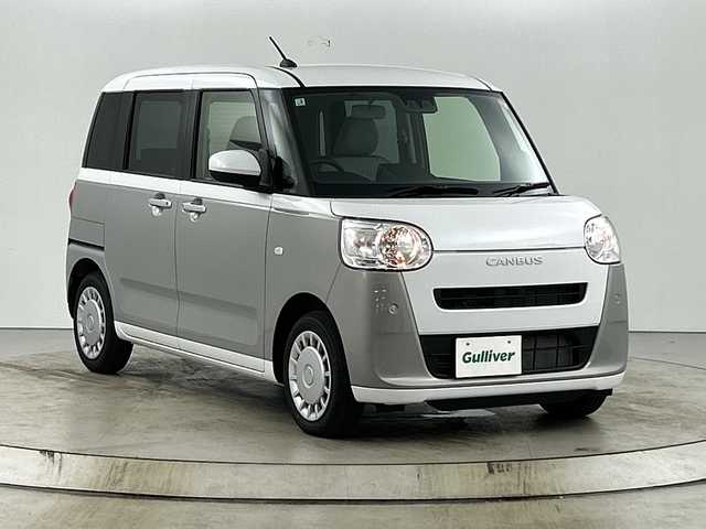 ダイハツ ムーヴ キャンバス ストライプス X 愛知県 2025(令7)年 0.4万km シャイニングホワイトパール/スムーズグレーマイカメタリック ナビ装着用アップグレードパック/スマートアシスト/・衝突回避支援ブレーキ機能/・誤発進抑制機能/・車線逸脱抑制機能/・先行車発進お知らせ機能/・コーナーセンサー/・オートハイビーム/ecoIDLE(アイドリングストップ)/両側パワースライドドア/ハロゲンヘッドランプ/オートライト/CANBUSエンブレム付シャイニングホワイトパールフロントグリル/シャイニングホワイトパールドアミラー/ステアリングスイッチ/アナログメーター/キーフリーシステム