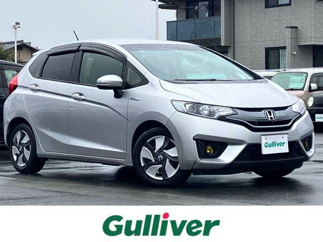 ホンダ フィット ハイブリット Lパッケージ 静岡県 2014(平26)年 7.9万km アラバスターシルバーメタリック エンジンスタートボタン/パワーステアリング/パワーウィンドウ/アイドリングストップ/スマートキー/スペアキー1本/オートエアコン/クルーズコントロール/ETC/ドライブレコーダー/SDナビ（CD/DVD/フルセグ）/純正フロアマット/ハーフレザーシート/ABS/横滑り防止装置/オートライト/LEDヘッドライト/Wエアバッグ