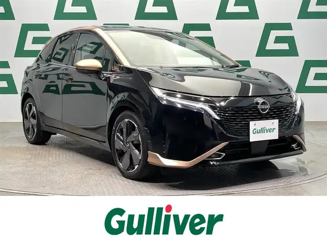 日産 オーラ G 鹿児島県 2022(令4)年 1万km ミッドナイトブラック/サンライズカッパー 禁煙　/衝突軽減　/追従型クルーズコントロール　/全方位カメラ　/デジタルインナーミラー　/前後コーナーセンサー　/革巻きステアリング　/ブラインドスポットモニター　/電動パーキングブレーキ/オートブレーキホールド　/オートライト/オートマチックハイビーム/取扱説明書/保証書