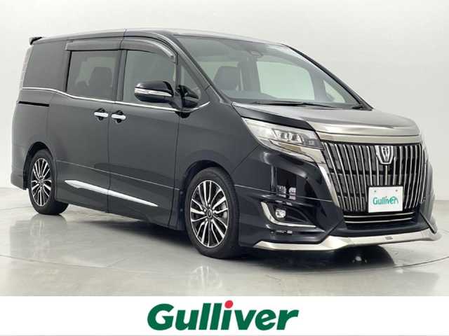 トヨタ エスクァイア Gi プレミアムパッケージ ブラックテーラード 熊本県 2019(令1)年 6.6万km ブラック アルパイン11インチナビEX11Z（ＣＤ・ＤＶＤ・フルセグ・ＢＴ・ＳＤ）/バックカメラ　/アルパインフリップダウンモニター/ビルトインＥＴＣ　/両側パワースライドドア　/前後クリアランスソナー　/モデリスタエアロ（Ｆ・Ｓ・Ｒ）/トヨタセーフティーセンス/・プリクラッシュセーフティ/・レーンディパーチャーアラート/・オートマチックハイビーム/・クルーズコントロール/横滑り防止/アイドリングストップ/前席シートヒーター/ステアリングヒーター/デジタルインナーミラー/ハーフレザーシート/純正フロアマット/社外１７インチAW/社外マフラー/オートライト/LEDヘッドライト/スマートキー/プッシュスタート/