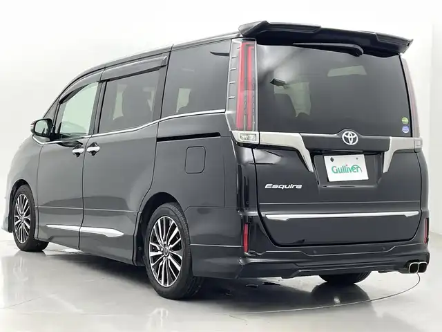 トヨタ エスクァイア Gi プレミアムパッケージ ブラックテーラード 熊本県 2019(令1)年 6.6万km ブラック アルパイン11インチナビEX11Z（ＣＤ・ＤＶＤ・フルセグ・ＢＴ・ＳＤ）/バックカメラ　/アルパインフリップダウンモニター/ビルトインＥＴＣ　/両側パワースライドドア　/前後クリアランスソナー　/モデリスタエアロ（Ｆ・Ｓ・Ｒ）/トヨタセーフティーセンス/・プリクラッシュセーフティ/・レーンディパーチャーアラート/・オートマチックハイビーム/・クルーズコントロール/横滑り防止/アイドリングストップ/前席シートヒーター/ステアリングヒーター/デジタルインナーミラー/ハーフレザーシート/純正フロアマット/社外１７インチAW/社外マフラー/オートライト/LEDヘッドライト/スマートキー/プッシュスタート/
