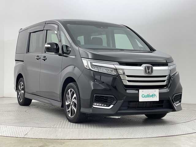ホンダ ステップワゴン スパーダ ホンダセンシング 新潟県 2021(令3)年 3.3万km プレミアムスパークルブラックパール 4WD/ホンダセンシング/　・衝突被害軽減システム/　・アダプティブクルーズコントロール/　・路外逸脱抑制機能/　・誤発進抑制機能/わくわくゲート/純正9インチナビ/　（フルセグTV/BT/CD/DVD/USB/AM/FM//　AppleCarPlay）/バックカメラ/両側パワースライドドア/LEDオートライト/純正16インチアルミホイール/アイドリングストップ/USBポート/スマートキー/ETC2.0