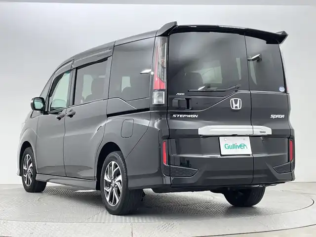 ホンダ ステップワゴン スパーダ ホンダセンシング 新潟県 2021(令3)年 3.3万km プレミアムスパークルブラックパール 4WD/ホンダセンシング/　・衝突被害軽減システム/　・アダプティブクルーズコントロール/　・路外逸脱抑制機能/　・誤発進抑制機能/わくわくゲート/純正9インチナビ/　（フルセグTV/BT/CD/DVD/USB/AM/FM//　AppleCarPlay）/バックカメラ/両側パワースライドドア/LEDオートライト/純正16インチアルミホイール/アイドリングストップ/USBポート/スマートキー/ETC2.0