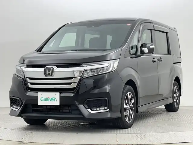 ホンダ ステップワゴン スパーダ ホンダセンシング 新潟県 2021(令3)年 3.3万km プレミアムスパークルブラックパール 4WD/ホンダセンシング/　・衝突被害軽減システム/　・アダプティブクルーズコントロール/　・路外逸脱抑制機能/　・誤発進抑制機能/わくわくゲート/純正9インチナビ/　（フルセグTV/BT/CD/DVD/USB/AM/FM//　AppleCarPlay）/バックカメラ/両側パワースライドドア/LEDオートライト/純正16インチアルミホイール/アイドリングストップ/USBポート/スマートキー/ETC2.0