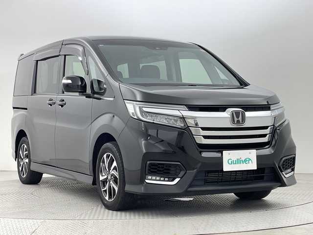 ホンダ ステップワゴン スパーダ ホンダセンシング 新潟県 2021(令3)年 3.3万km プレミアムスパークルブラックパール 4WD/ホンダセンシング/　・衝突被害軽減システム/　・アダプティブクルーズコントロール/　・路外逸脱抑制機能/　・誤発進抑制機能/わくわくゲート/純正9インチナビ/　（フルセグTV/BT/CD/DVD/USB/AM/FM//　AppleCarPlay）/バックカメラ/両側パワースライドドア/LEDオートライト/純正16インチアルミホイール/アイドリングストップ/USBポート/スマートキー/ETC2.0