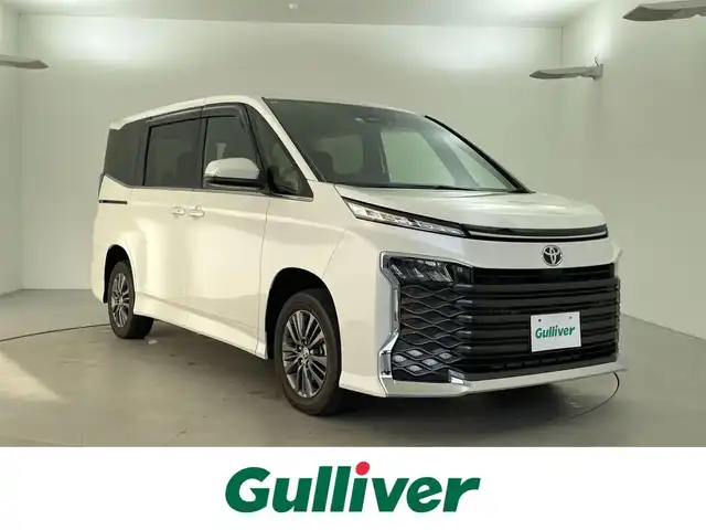 トヨタ ヴォクシー S－Z 福井県 2022(令4)年 2.4万km ホワイトパールクリスタルシャイン ４ＷＤ　/純正ナビ機能付きディスプレイオーディオプラス　/（ＦＭ／ＡＭ／ＢＴ／ＣＤ／ＤＶＤ／ＨＤＭＩ）　/純正１２．３型フリップダウンモニター/両側パワースライドドア/快適利便パッケージ/純正ＥＴＣ２．０/電動リアゲート/純正16インチアルミホイール/純正フロアマット/スペアキー/トヨタセーフティセンス