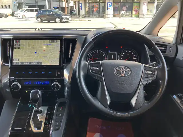 トヨタ ヴェルファイア Z Gエディション 神奈川県 2018(平30)年 7.7万km ホワイトパールクリスタルシャイン ワンオーナー/新車保証書/取扱説明書/レザーシート/サンルーフ/モデリスタエアロ/3眼LEDヘッドライト/トヨタセーフティセンス/・レーンレーシングアシスト/・クリアランスソナー/・プリクラッシュセーフティ/・ロードサインアシスト/・レーダークルーズコントロール（全車速追従機能付き）/・オートマチックハイビーム/純正ナビ・フルセグTV/CD・DVDビデオ・Bluetooth/HDMI・USB・SD/バックカメラ/デジタルインナーミラー/純正フリップダウンモニター/ビルトインETC2.0/前席パワーシート/前席快適温熱シート/助手席・後席電動オットマン/後席エグゼクティブパワーシート/両側パワースライドドア/パワーバックドア/ステアリングスイッチ/サンシェード/純正18インチアルミホイール/ドアバイザー/フロアーマット