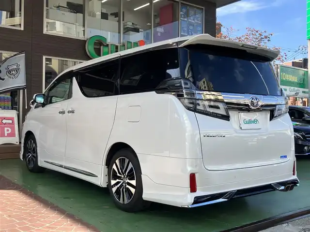 トヨタ ヴェルファイア Z Gエディション 神奈川県 2018(平30)年 7.7万km ホワイトパールクリスタルシャイン ワンオーナー/新車保証書/取扱説明書/レザーシート/サンルーフ/モデリスタエアロ/3眼LEDヘッドライト/トヨタセーフティセンス/・レーンレーシングアシスト/・クリアランスソナー/・プリクラッシュセーフティ/・ロードサインアシスト/・レーダークルーズコントロール（全車速追従機能付き）/・オートマチックハイビーム/純正ナビ・フルセグTV/CD・DVDビデオ・Bluetooth/HDMI・USB・SD/バックカメラ/デジタルインナーミラー/純正フリップダウンモニター/ビルトインETC2.0/前席パワーシート/前席快適温熱シート/助手席・後席電動オットマン/後席エグゼクティブパワーシート/両側パワースライドドア/パワーバックドア/ステアリングスイッチ/サンシェード/純正18インチアルミホイール/ドアバイザー/フロアーマット