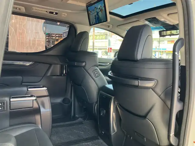 トヨタ ヴェルファイア Z Gエディション 神奈川県 2018(平30)年 7.7万km ホワイトパールクリスタルシャイン ワンオーナー/新車保証書/取扱説明書/レザーシート/サンルーフ/モデリスタエアロ/3眼LEDヘッドライト/トヨタセーフティセンス/・レーンレーシングアシスト/・クリアランスソナー/・プリクラッシュセーフティ/・ロードサインアシスト/・レーダークルーズコントロール（全車速追従機能付き）/・オートマチックハイビーム/純正ナビ・フルセグTV/CD・DVDビデオ・Bluetooth/HDMI・USB・SD/バックカメラ/デジタルインナーミラー/純正フリップダウンモニター/ビルトインETC2.0/前席パワーシート/前席快適温熱シート/助手席・後席電動オットマン/後席エグゼクティブパワーシート/両側パワースライドドア/パワーバックドア/ステアリングスイッチ/サンシェード/純正18インチアルミホイール/ドアバイザー/フロアーマット